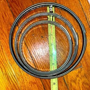 Antique spring form embroidery hoop set of three with cork lining.